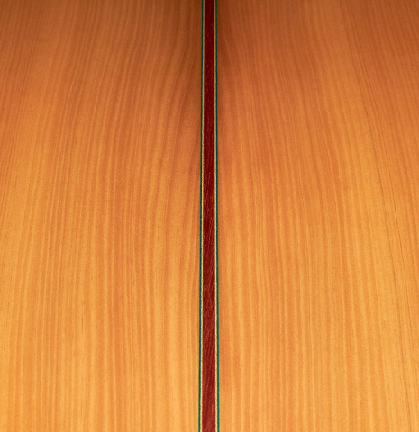 The close-up of the cypress back of a 2022 Vicente Carrillo &quot;1aF Blanca&quot; flamenco guitar made with spruce top