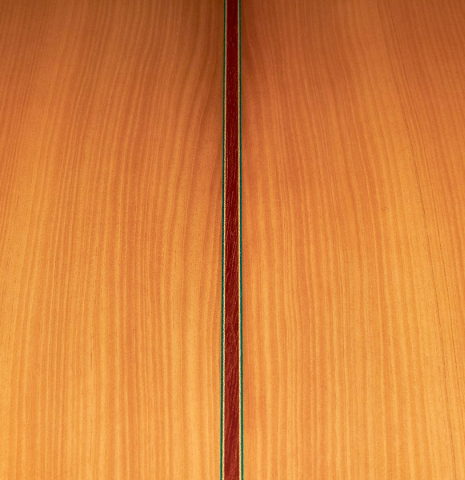 The close-up of the cypress back of a 2022 Vicente Carrillo "1aF Blanca" flamenco guitar made with spruce top