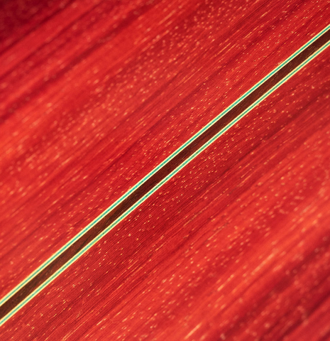 The back and sides of a 2004 Vicente Carrillo &quot;1aF Negra&quot; flamenco guitar made of spruce and padauk