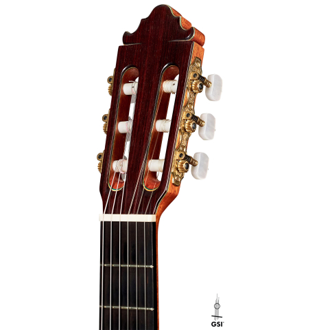 The headstock of a 2004 Vicente Carrillo &quot;1aF Negra&quot; flamenco guitar made of spruce and padauk
