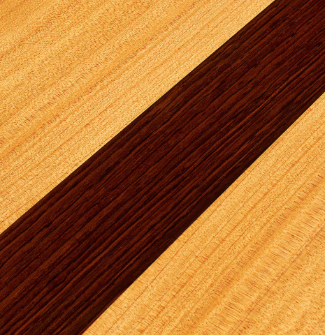 This is a closeup of the cypress back with CSA rosewood inlay of a 2007 Juan Miguel Carmona flamenco guitar made with spruce and cypress