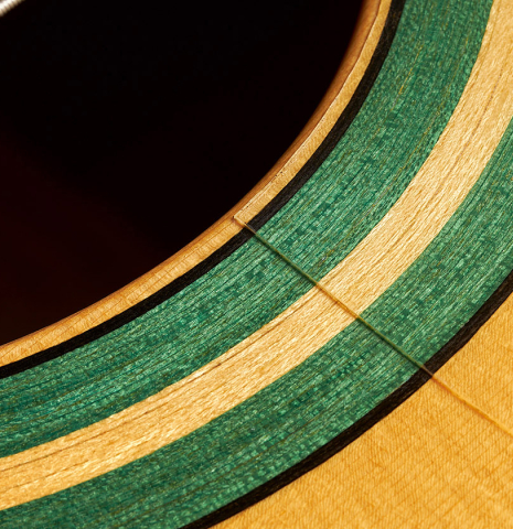 This is a close-up of the rosette of a 2007 Juan Miguel Carmona flamenco guitar made with spruce and cypress