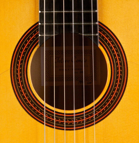 The rosette of a 2018 Felipe Conde "FP 14" (cutaway electric) flamenco guitar made of spruce and cypress