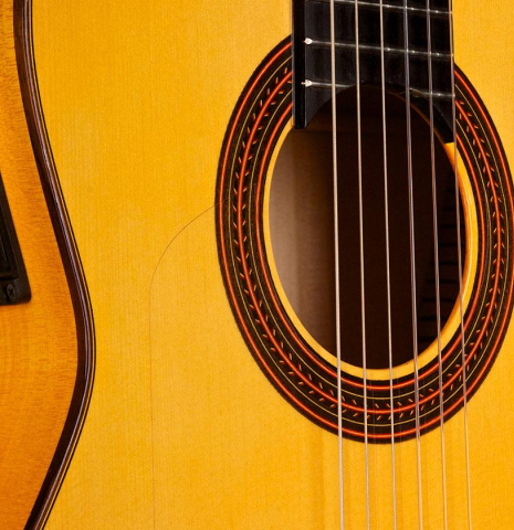 The soundboard of a 2018 Felipe Conde "FP 14" (cutaway electric) flamenco guitar made of spruce and cypress