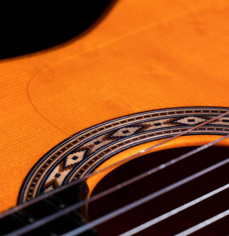 The soundboard and rosette of a 2018 Felipe Conde &quot;Pepe Habichuela&quot; flamenco guitar made of spruce and cypress