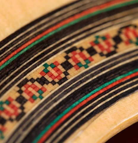 A close-up of the rosette of a 2019 Felipe Conde "FP 16" flamenco guitar made of spruce and cypress