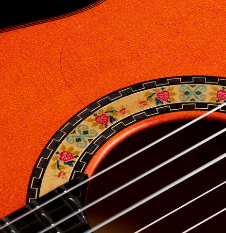 Detailed close-up of the rosette of a 2024 Felipe Conde "A 26 Especial" flamenco guitar made of spruce and cypress