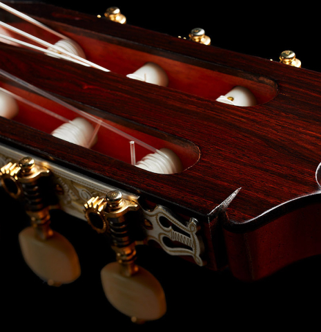 The media luna headstock shape of a 2024 Felipe Conde "FC 28 Especial" flamenco negra guitar made of spruce and CSA rosewood