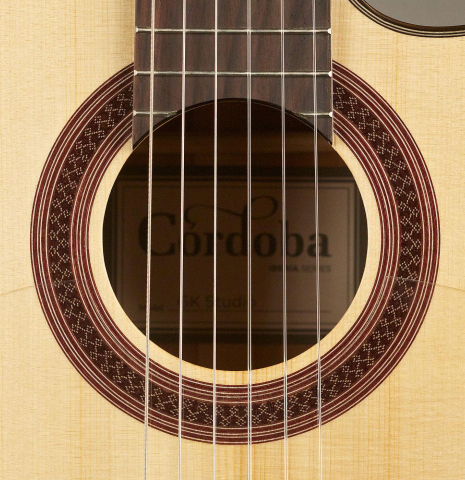 The rosette of a Cordoba "GK Studio" flamenco guitar made of spruce and cypress