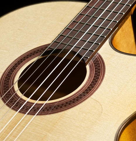 The soundboard of a Cordoba "GK Studio" flamenco guitar made of spruce and cypress