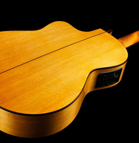 The back and cutaway of a Cordoba &quot;GK Studio&quot; flamenco guitar made of spruce and cypress