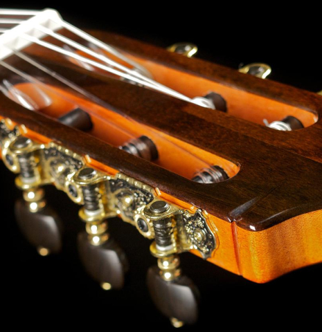 The headstock of a Cordoba "GK Studio" flamenco guitar made of spruce and cypress