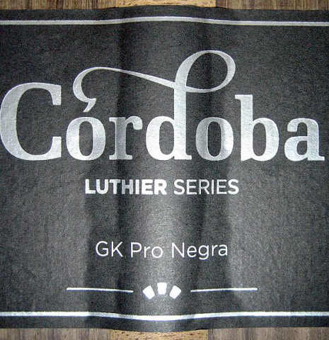The label of Cordoba "GK Pro Negra" classical guitar made with spruce and Indian rosewood, cutaway and electronics