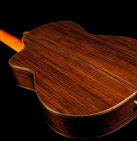 The back, sides and cutaway of Cordoba "GK Pro Negra" classical guitar made with spruce and Indian rosewood and with electronics