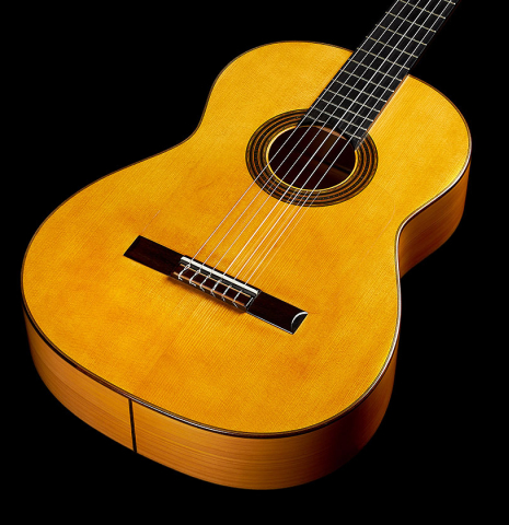 The soundboard and sides of a 2018 Luis Fernandez de Cordoba "Blanca" flamenco guitar made of spruce and cypress