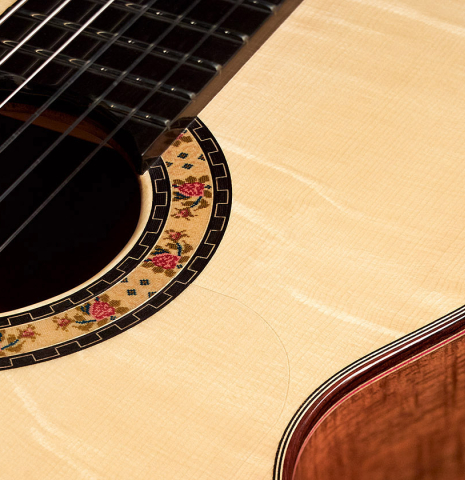 The soundboard and rosette detail of a 2023 Felipe Conde Crespo "Negra" flamenco guitar made of spruce and koa
