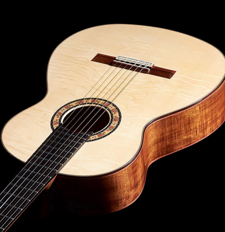 The top and sides of a 2023 Felipe Conde Crespo "Negra" flamenco guitar made of spruce and koa