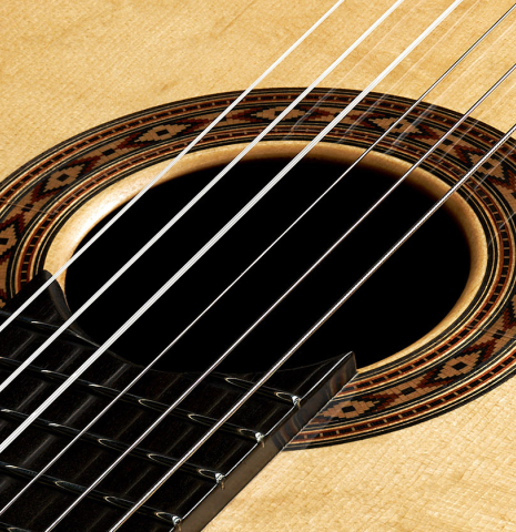 The top and rosette of a 2023 Felipe Conde Crespo "Negra" flamenco guitar made of spruce and African rosewood