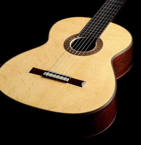 The soundboard of a 2023 Felipe Conde Crespo "Negra" flamenco guitar made of spruce and African rosewood