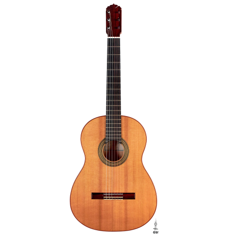 The front of a a 2015 Andy Culpepper flamenco guitar made with cedar and cypress wood on a white background.