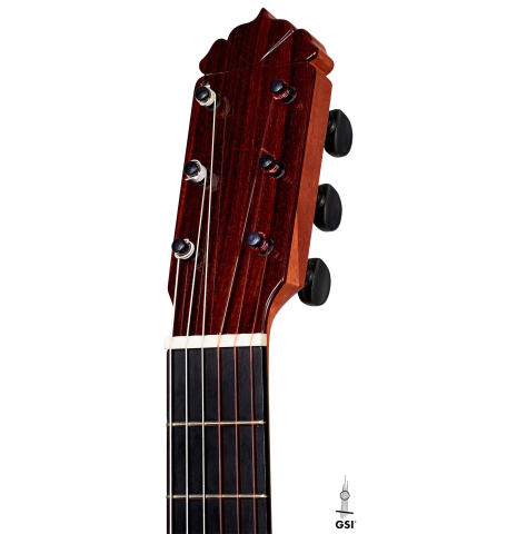 The headstock and traditional tuning pegs of a 2015 Andy Culpepper flamenco guitar.