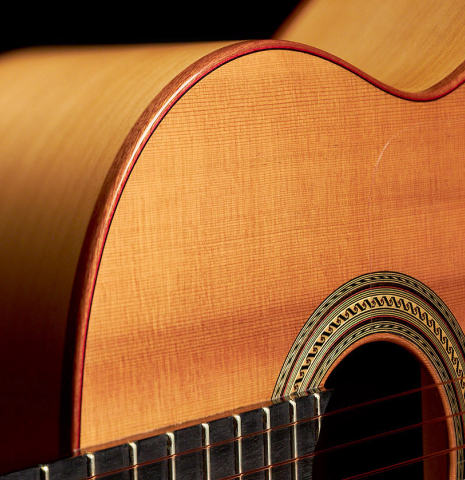 The soundboard and rosette of a 2015 Andy Culpepper flamenco guitar made with cedar and cypress wood.