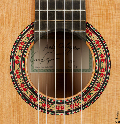 The rosette of a 2024 Andy Culpepper w/pegs flamenco guitar made of cedar and cypress