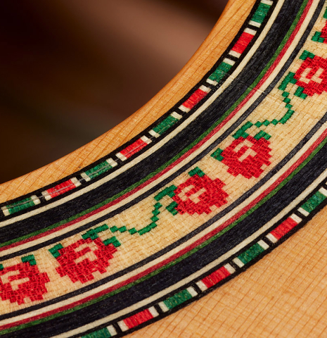 Detailed close-up of the rosette of a 2024 Andy Culpepper w/pegs flamenco guitar made of cedar and cypress