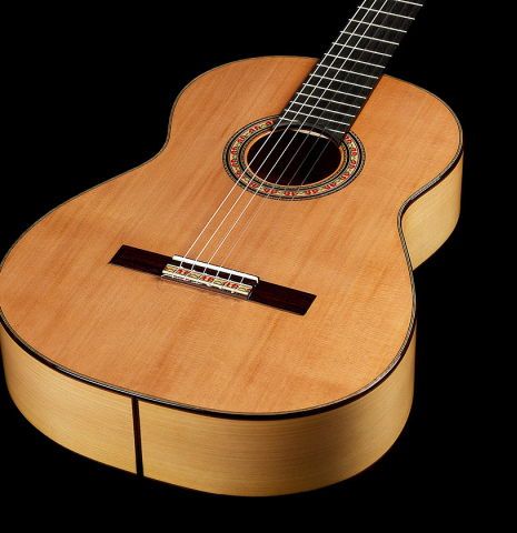 The soundboard of a 2024 Andy Culpepper w/pegs flamenco guitar made of cedar and cypress