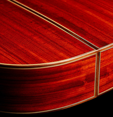 The back and sides at the foot of a 2012 Andy Culpepper "Coral" flamenco guitar made of spruce and padauk
