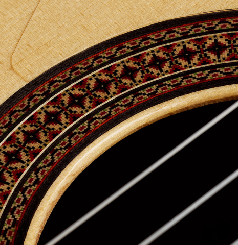 Close-up detail of the rosette of a 2012 Andy Culpepper "Coral" flamenco guitar made of spruce and padauk
