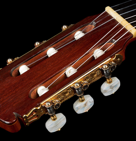 The headstock and tuning machines of a 1966 Manuel de la Chica flamenco guitar made of spruce and cypress