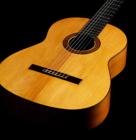 The soundboard of a 1957 Manuel de la Chica flamenco guitar with pegs made of spruce and cypress