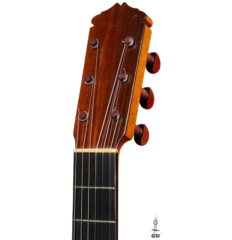The headstock of a 1957 Manuel de la Chica flamenco guitar with pegs made of spruce and cypress