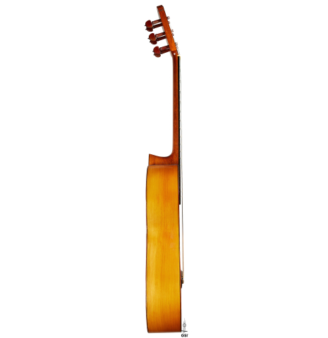 The side of a 1957 Manuel de la Chica flamenco guitar with pegs made of spruce and cypress