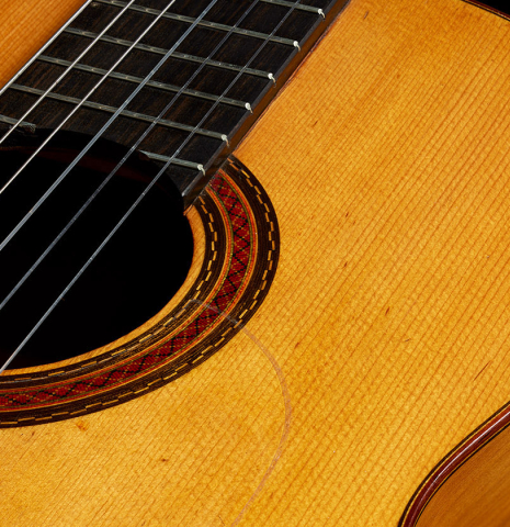 The top and rosette of a 1957 Manuel de la Chica flamenco guitar with pegs made of spruce and cypress