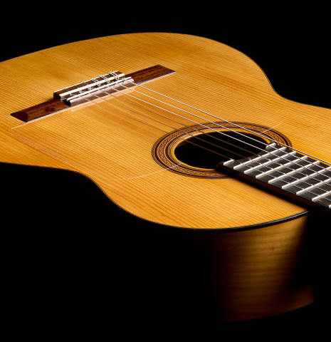 The top and sides of a 1961 Manuel de la Chica flamenco blanca guitar made of spruce and cypress