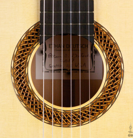 The rosette of a 2017 Ethan Deutsch flamenco guitar with pegs made with spruce and cypress
