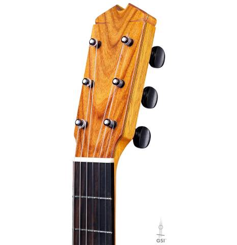 The headstock of a 2017 Ethan Deutsch flamenco guitar with pegs made with spruce and cypress