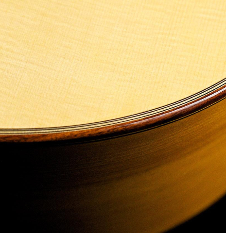 The sides, purflings, binding and soundboard of a 2017 Ethan Deutsch flamenco guitar with pegs made with spruce and cypress