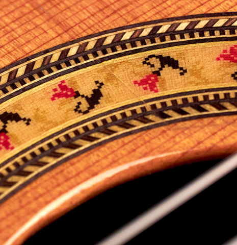 The rosette of a 1997 Lester DeVoe &quot;Negra&quot; flamenco guitar made of cedar and Indian rosewood