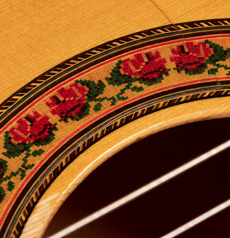 The rosette of a 1985 Lester DeVoe flamenco guitar made with spruce and cypress.