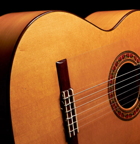 The soundboard of a 1985 Lester DeVoe flamenco guitar made with spruce and cypress.