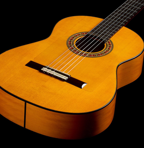 The top and sides of a 2012 Lester DeVoe w/pegs flamenco guitar made of spruce and cypress
