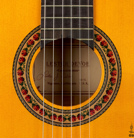 The rosette of a 2012 Lester DeVoe w/pegs flamenco guitar made of spruce and cypress