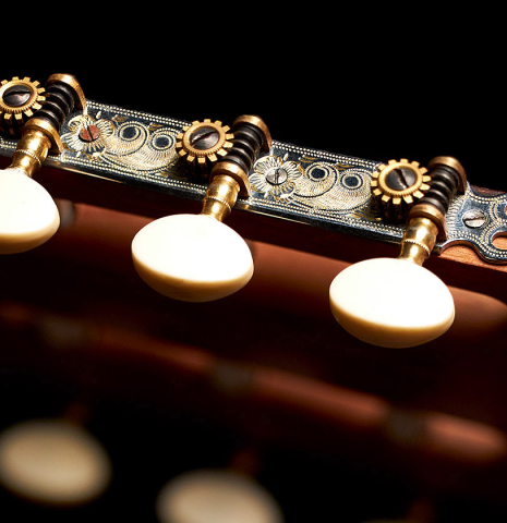 The machine heads of a 1927 Domingo Esteso vintage flamenco guitar made of spruce and cypress