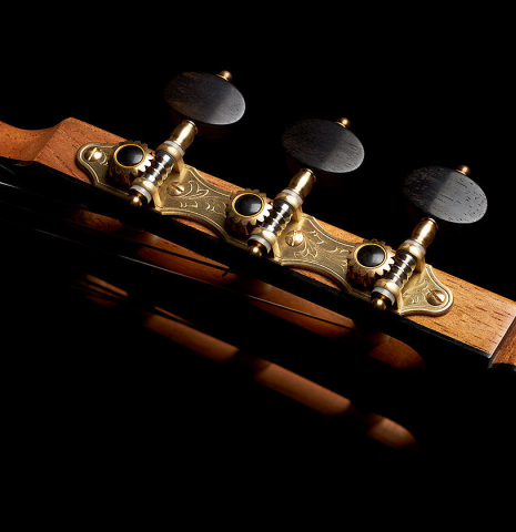 The headstock and tuning machines of a 2023 Paco Fajardo flamenco guitar made of spruce and cypress