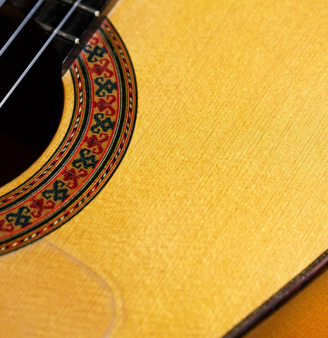 The top and rosette detail of a 1961 Arcangel Fernandez flamenco blanca guitar made of spruce and cypress
