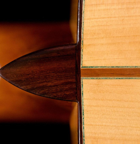 The heelcap and back center seam of a 2018 Gerundino Fernandez Hijo cedar/cypress "Blanca" flamenco guitar with pegs