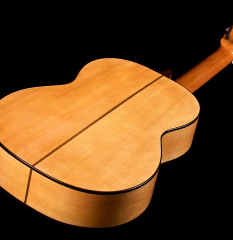 The back and sides of a 2018 Gerundino Fernandez Hijo cedar/cypress "Blanca" flamenco guitar with pegs